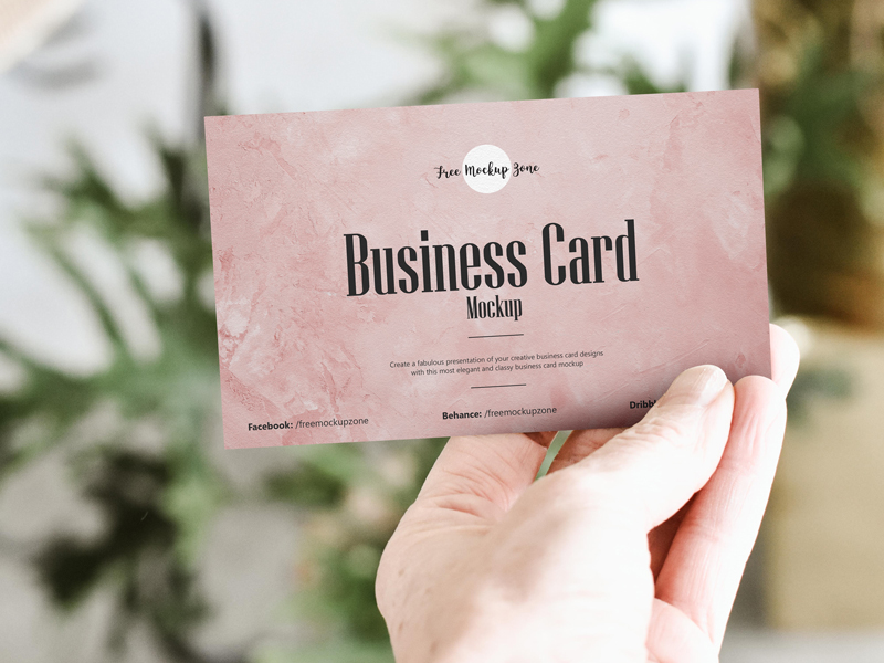 Free Holding Business Card PSD Mockup